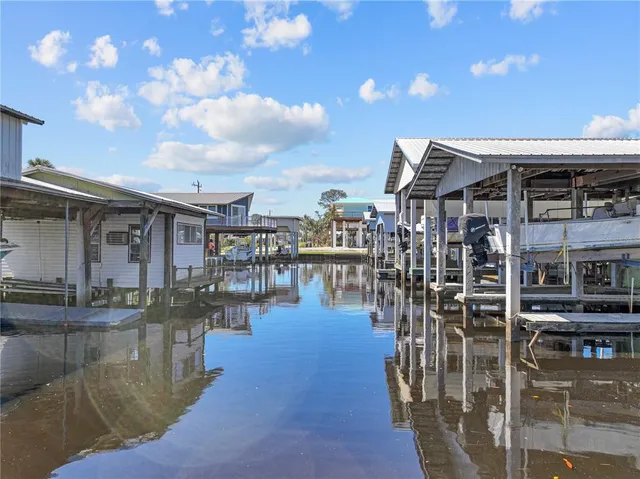 an aerial view of a house with yard swimming pool and outdoor seating