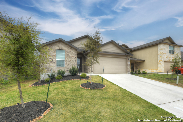 15120 Longtailed Duck San Antonio, TX 78253 - Photo 1 of 24 a front view of a house with a yard and garage