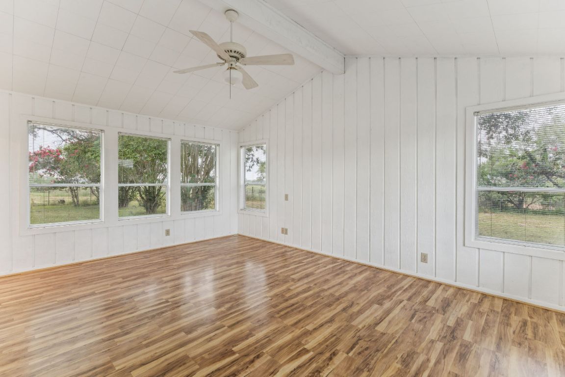 9611 Wilke Road Kingsbury, TX 78638 - Photo 12 of 23 a view of an empty room with a window and wooden floor