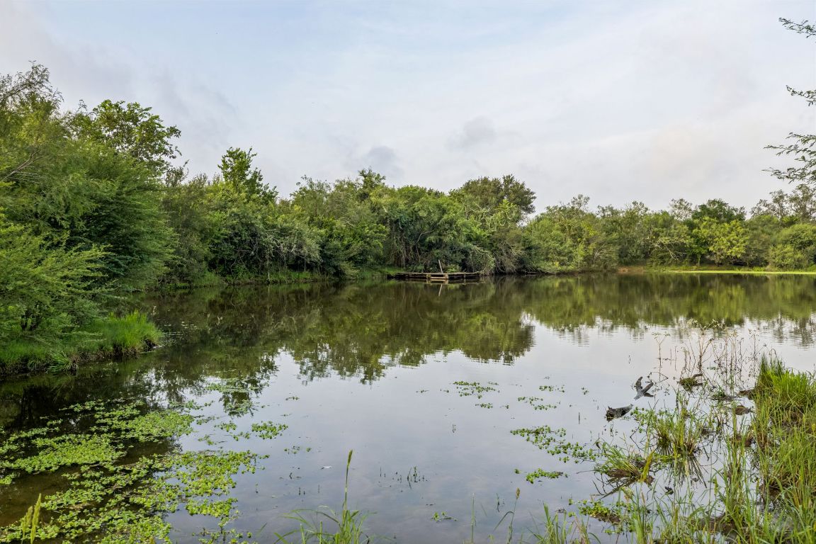 9611 Wilke Road Kingsbury, TX 78638 - Photo 14 of 23 a view of a lake with a mountain in the background
