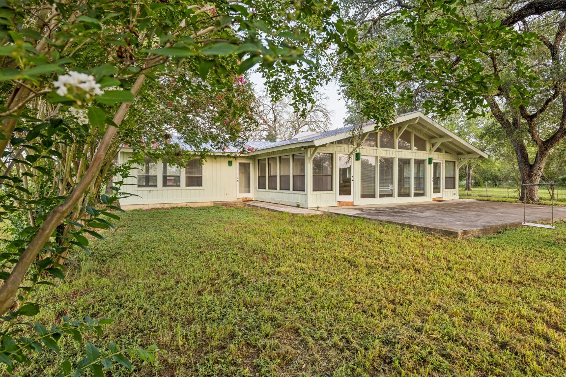 9611 Wilke Road Kingsbury, TX 78638 - Photo 2 of 23 a front view of a house with a garden