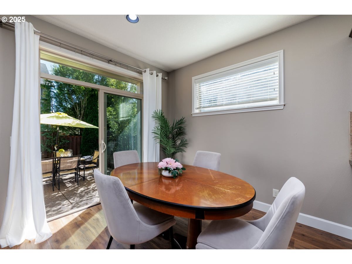 5598 Northwest 135th Avenue Portland, OR 97229 - Photo 17 of 45 a view of a dining room with furniture window and outside view