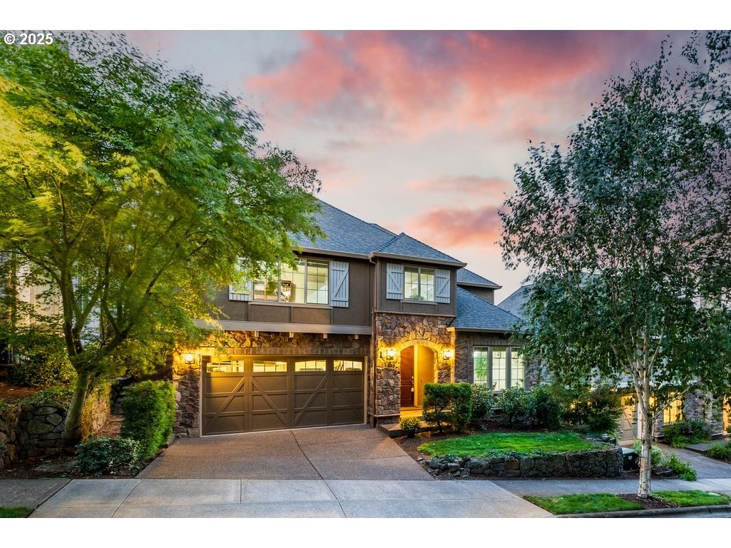 5598 Northwest 135th Avenue Portland, OR 97229 - Photo 2 of 45 a front view of a house with a yard