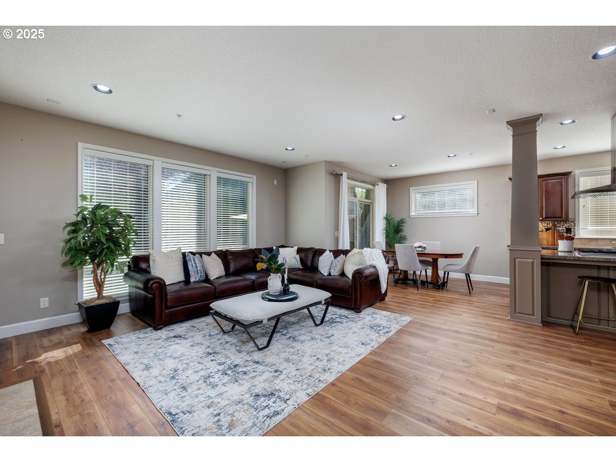 5598 Northwest 135th Avenue Portland, OR 97229 - Photo 22 of 45 a living room with furniture and wooden floor