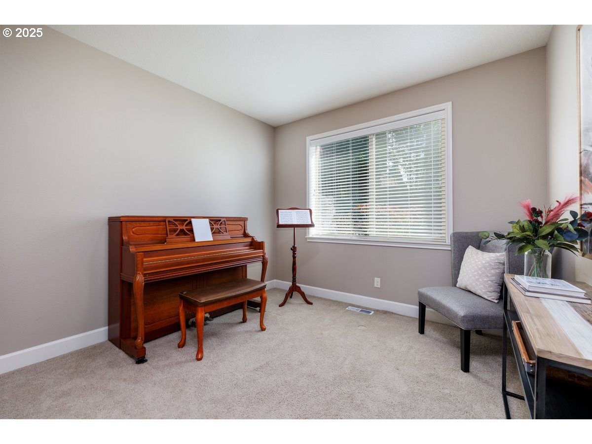 5598 Northwest 135th Avenue Portland, OR 97229 - Photo 23 of 45 a living room with furniture a piano and a window