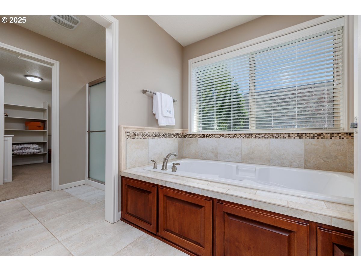 5598 Northwest 135th Avenue Portland, OR 97229 - Photo 30 of 45 a bathroom with a sink and a mirror