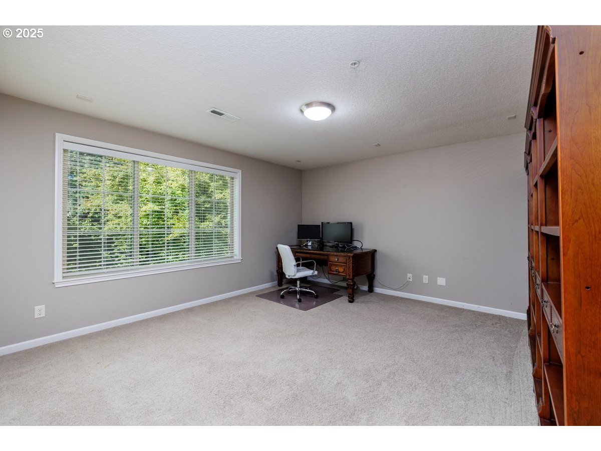 5598 Northwest 135th Avenue Portland, OR 97229 - Photo 34 of 45 a view of workspace with furniture and a window