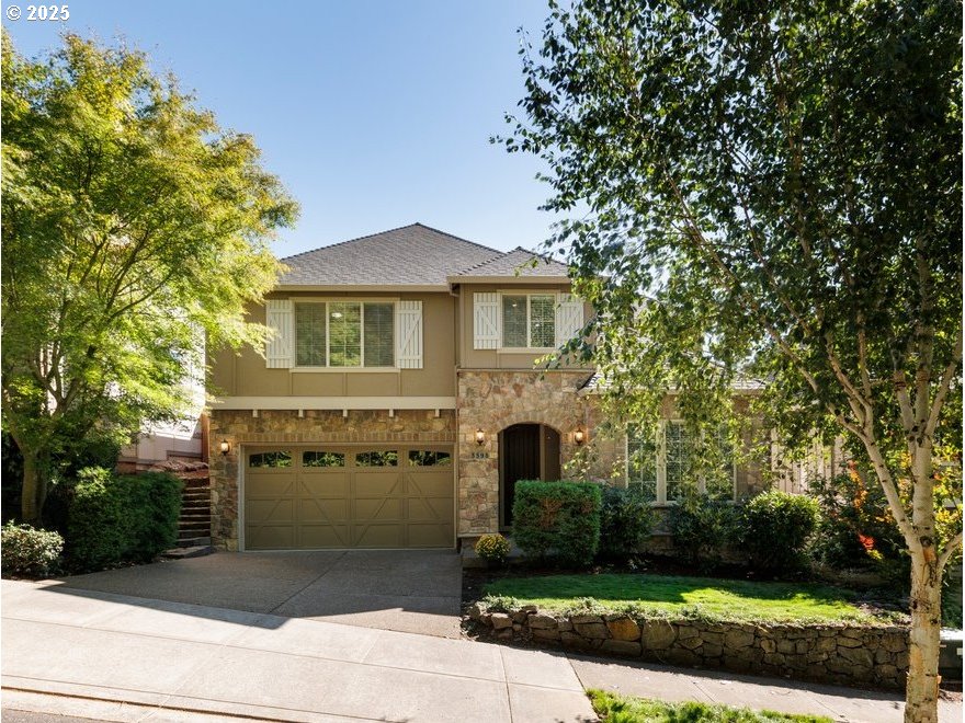 5598 Northwest 135th Avenue Portland, OR 97229 - Photo 4 of 45 a front view of a house with a yard