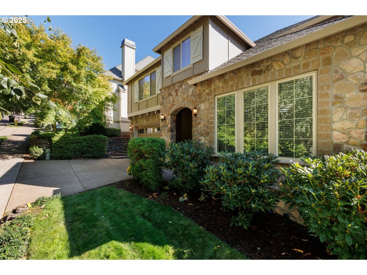 5598 Northwest 135th Avenue Portland, OR 97229 - Photo 7 of 45 a view of a building with a garden