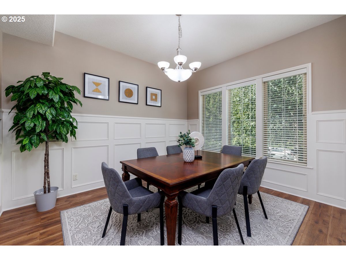 5598 Northwest 135th Avenue Portland, OR 97229 - Photo 10 of 45 a view of a dining room with furniture window and wooden floor