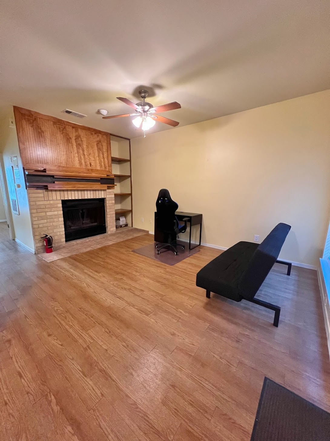 908 Poplar Street, Unit 207 Austin, TX 78705 - Photo 4 of 19 a living room with furniture fireplace and a fireplace
