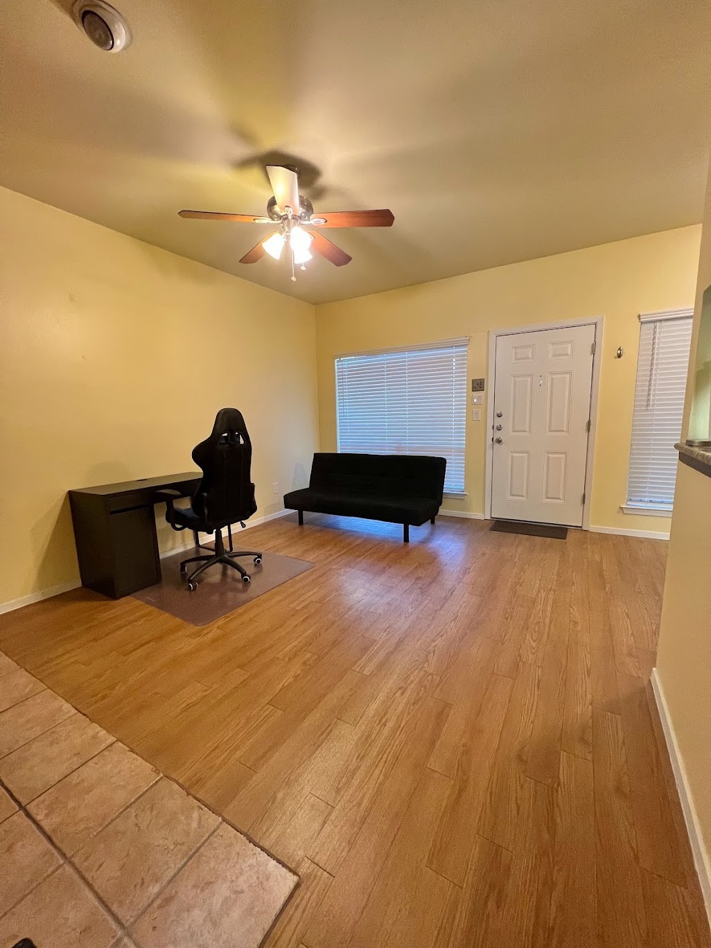 908 Poplar Street, Unit 207 Austin, TX 78705 - Photo 5 of 19 a living room with furniture and a wooden floor