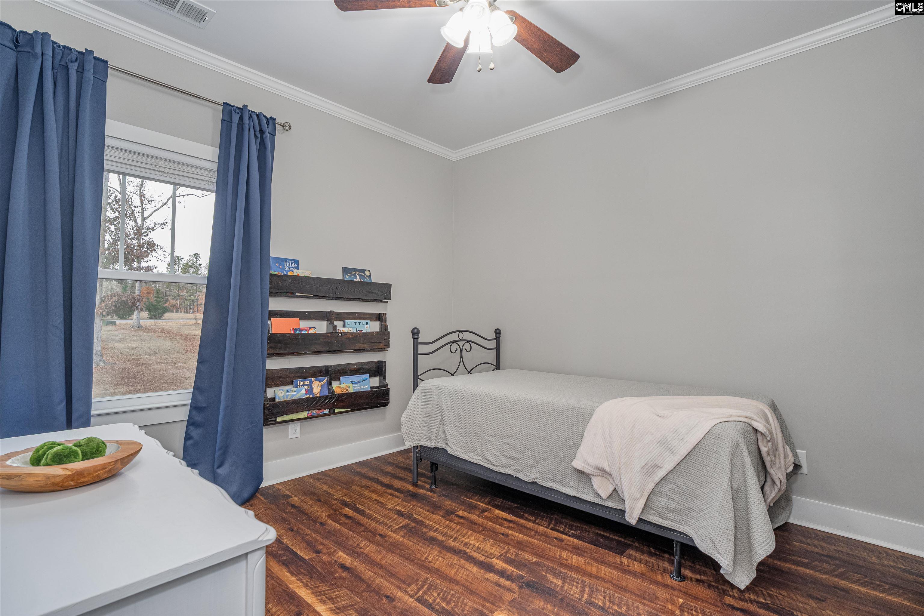 649 Sandbar Road Chapin, SC 29036 - Photo 15 of 40 a bedroom with a bed and a window