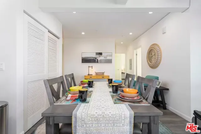 a view of a dining room with furniture and a window