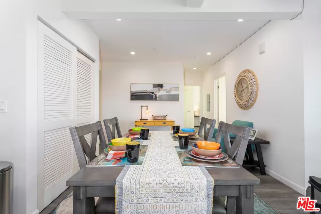 a view of a dining room with furniture and a window