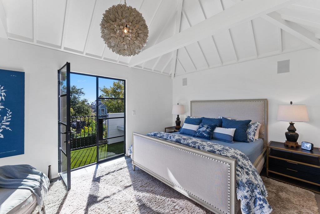 109 Central Avenue Capitola, CA 95010 - Photo 32 of 79 a bed room with furniture and a floor to ceiling window