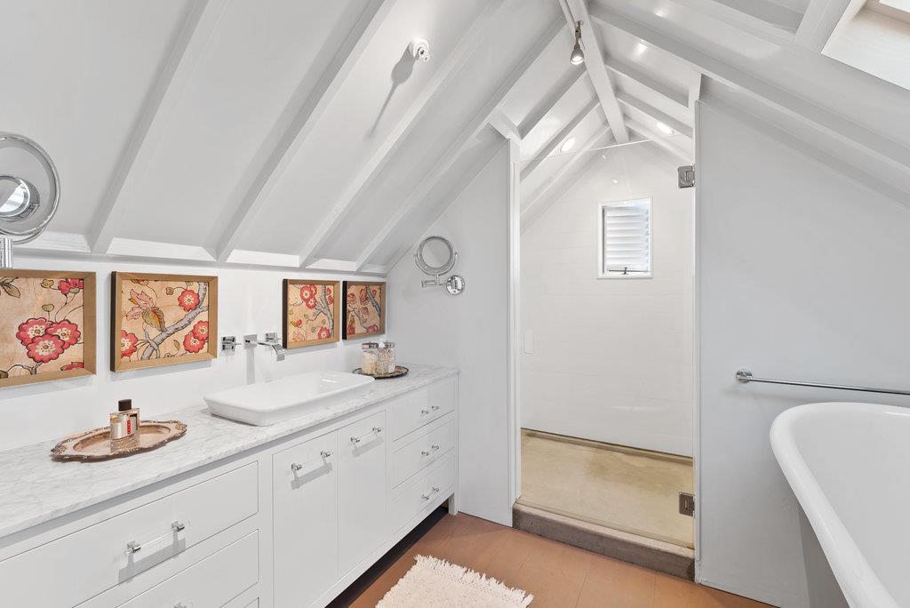 109 Central Avenue Capitola, CA 95010 - Photo 37 of 79 a spacious bathroom with a granite countertop sink and a mirror