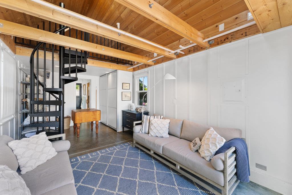 109 Central Avenue Capitola, CA 95010 - Photo 42 of 79 a living room with furniture and a large window