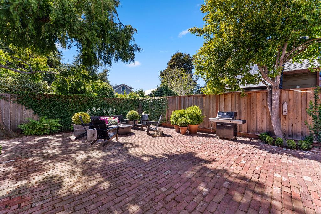 109 Central Avenue Capitola, CA 95010 - Photo 56 of 79 a view of a backyard with a sitting area and a garden