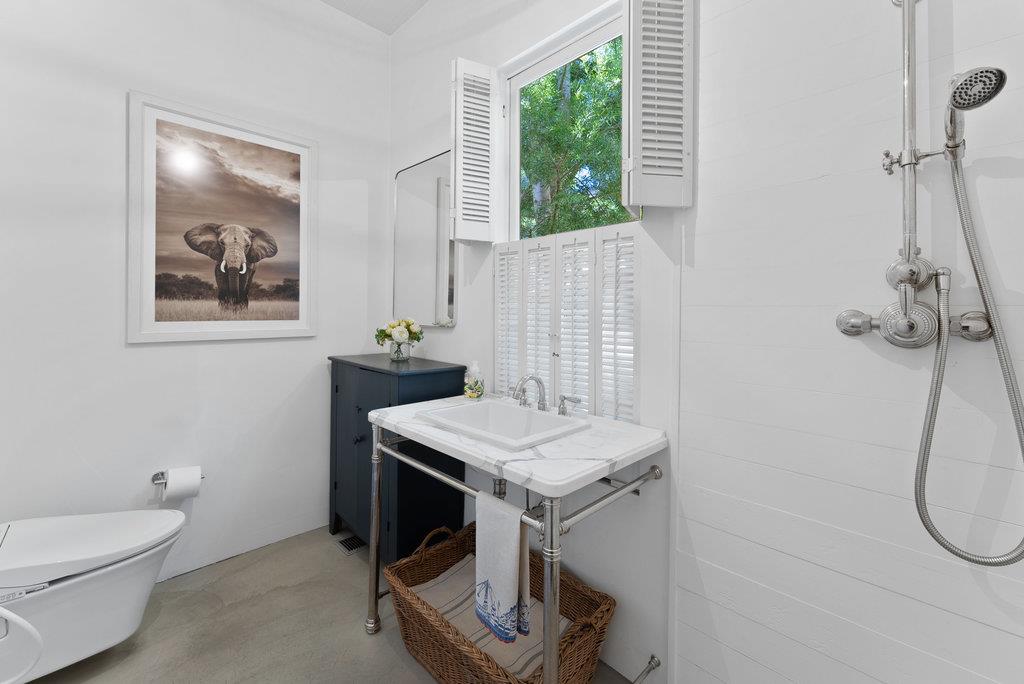 109 Central Avenue Capitola, CA 95010 - Photo 61 of 79 a bathroom with a sink a toilet and a shower