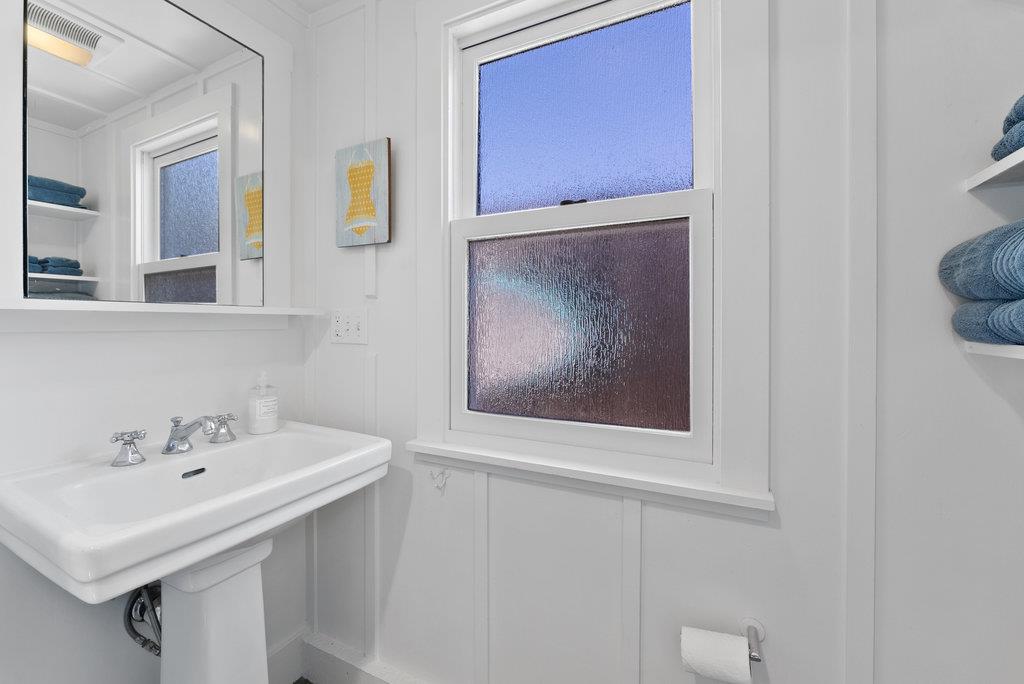 109 Central Avenue Capitola, CA 95010 - Photo 63 of 79 a bathroom with a sink and a mirror