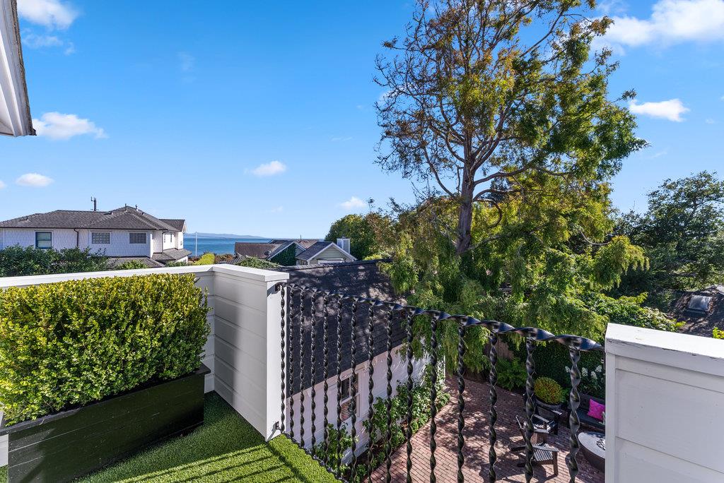109 Central Avenue Capitola, CA 95010 - Photo 68 of 79 a view of a house with a tree and plants