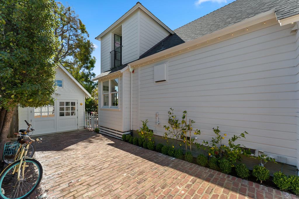 109 Central Avenue Capitola, CA 95010 - Photo 70 of 79 a backyard of a house with flower plants