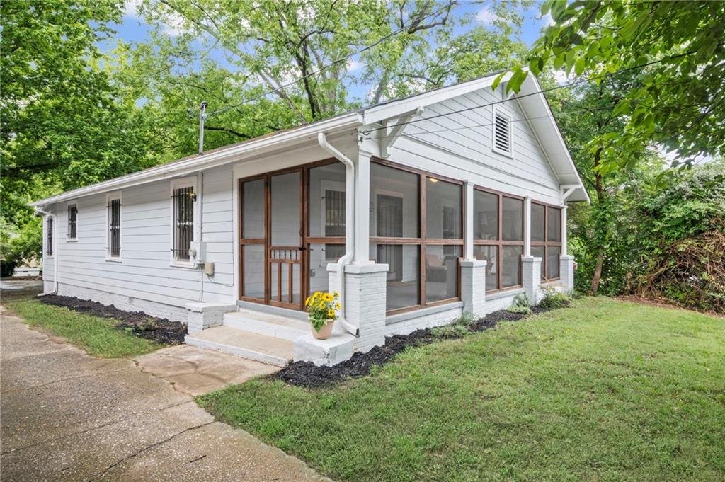 1591 Jonesboro Road Southeast Atlanta, GA 30315 - Photo 1 of 1 a view of a house with yard and plants