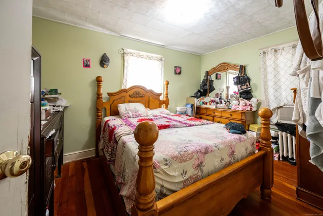 a bedroom with furniture and a window