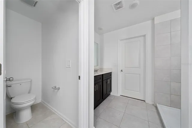 a bathroom with a toilet and a sink