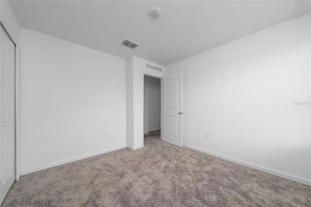 a bathroom with a bathtub sink vanity granite and toilet