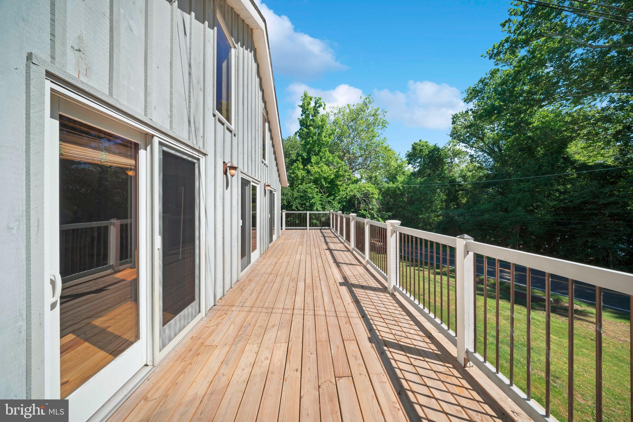 1473 North River Road Yardley, PA 19067 - Photo 8 of 42 a view of balcony with wooden floor and fence