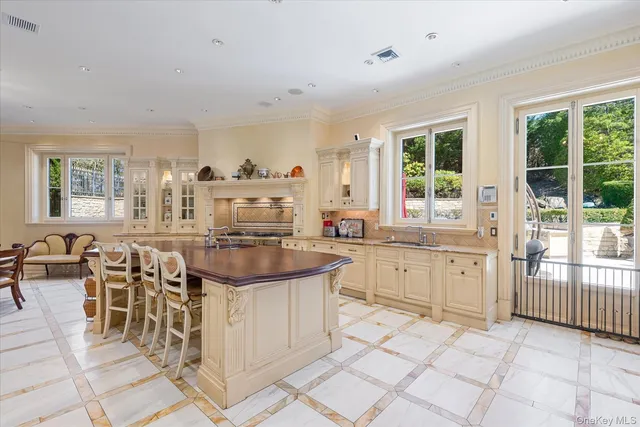 a kitchen with sink and cabinets