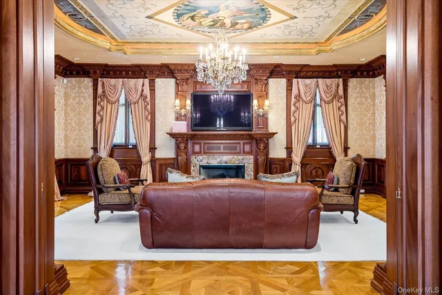 a bedroom with a bed and large windows