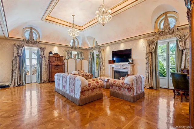 a living room with fireplace furniture and a flat screen tv