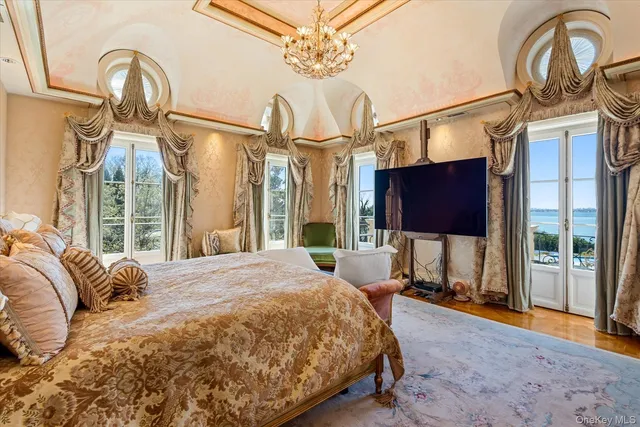 a bedroom with a bed dresser and a window