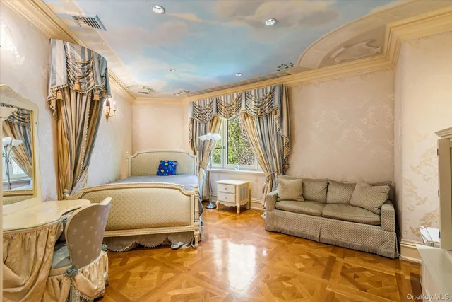 a bedroom with furniture and a window