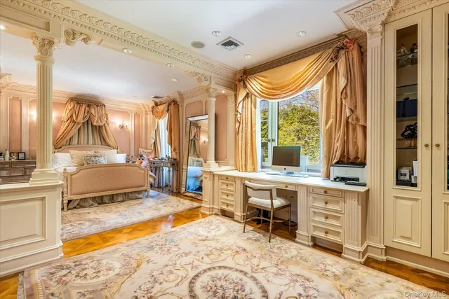 a spacious bathroom with a double vanity sink and a tub