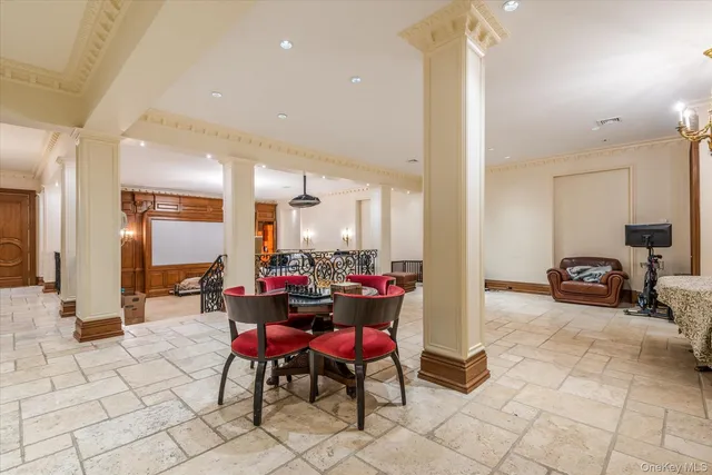 a lobby with furniture and a rug