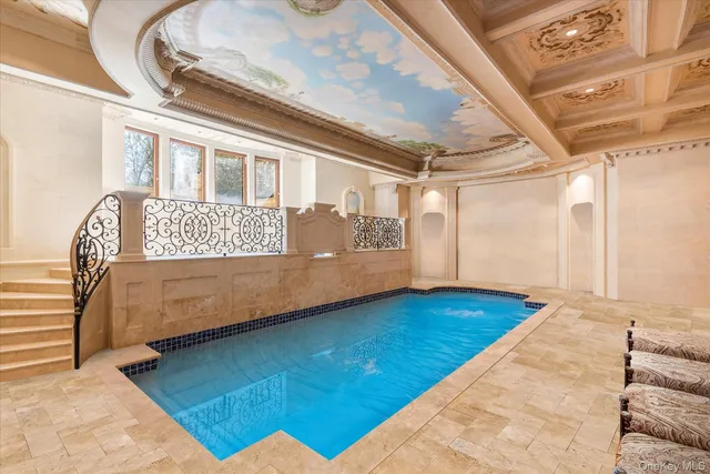 a view of a bedroom with wooden floor and chair