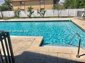 a view of swimming pool from a balcony