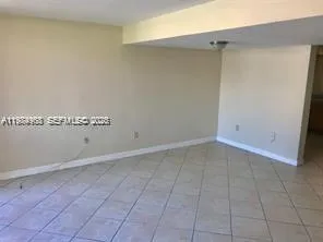 an empty room with a bench