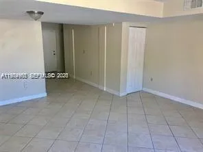 an empty room with a bench