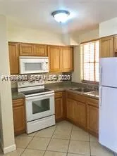 a kitchen with stainless steel appliances granite countertop a stove and a sink