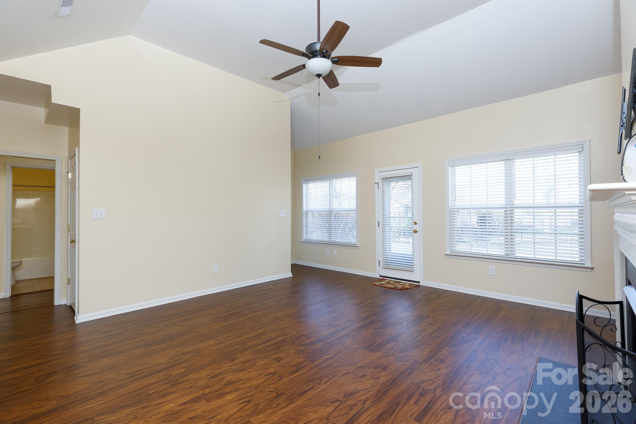 424 Elizabeth Valley Lane Clover, SC 29710 - Photo 11 of 27 a view of an empty room with wooden floor and a window
