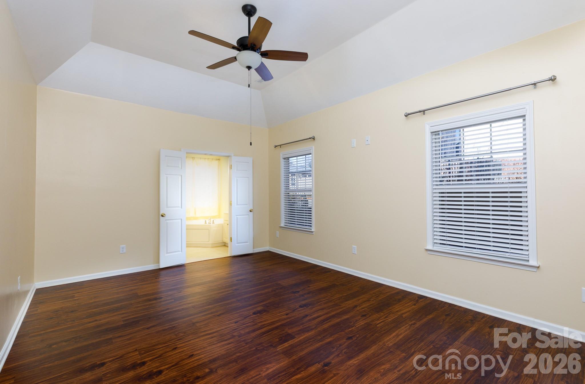 424 Elizabeth Valley Lane Clover, SC 29710 - Photo 14 of 27 a view of an empty room with wooden floor and a window