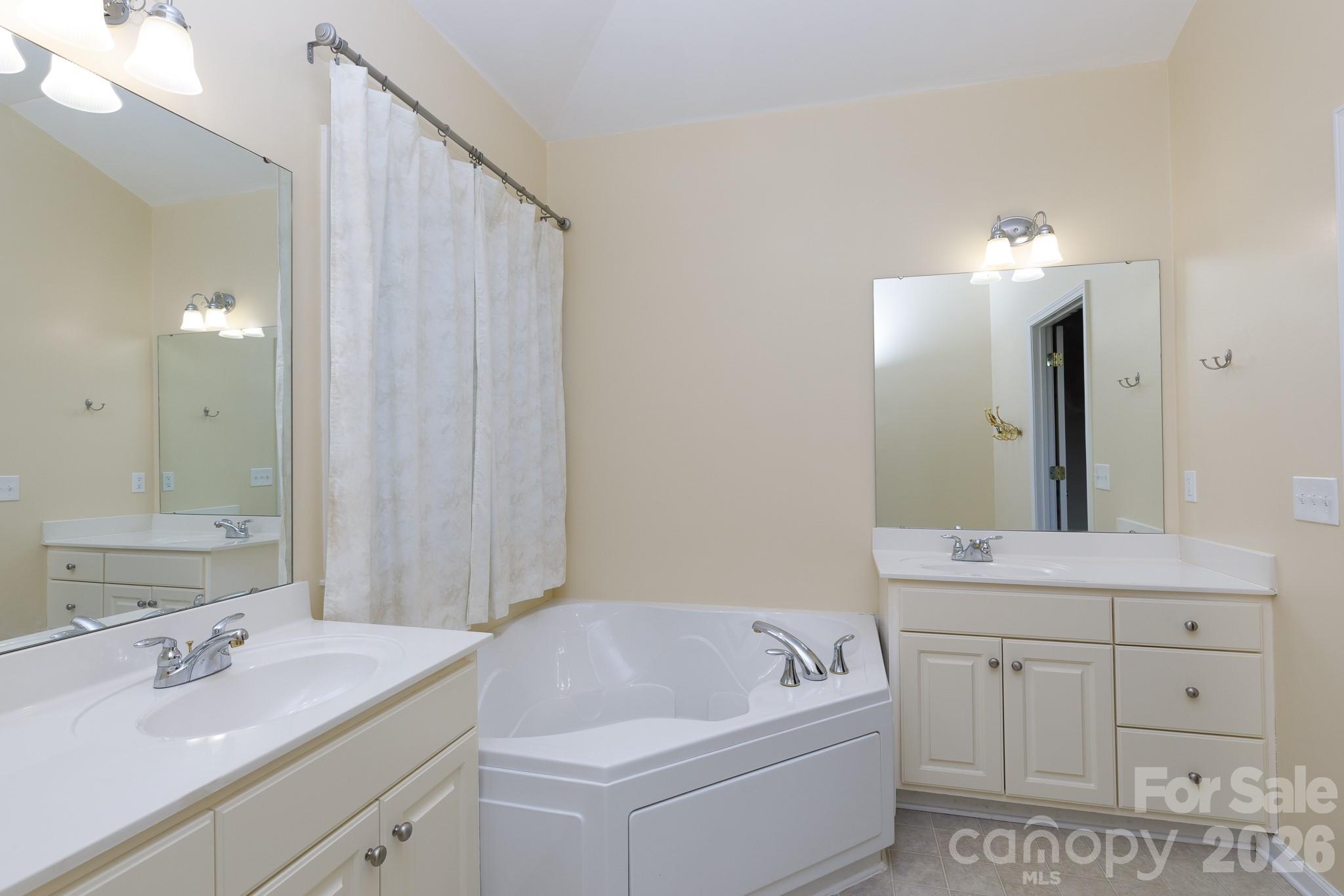 424 Elizabeth Valley Lane Clover, SC 29710 - Photo 17 of 27 a bathroom with a sink a vanity and a mirror
