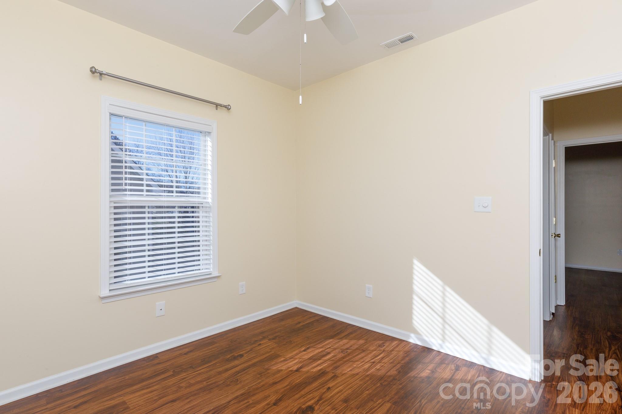 424 Elizabeth Valley Lane Clover, SC 29710 - Photo 20 of 27 a view of an empty room with wooden floor and a window