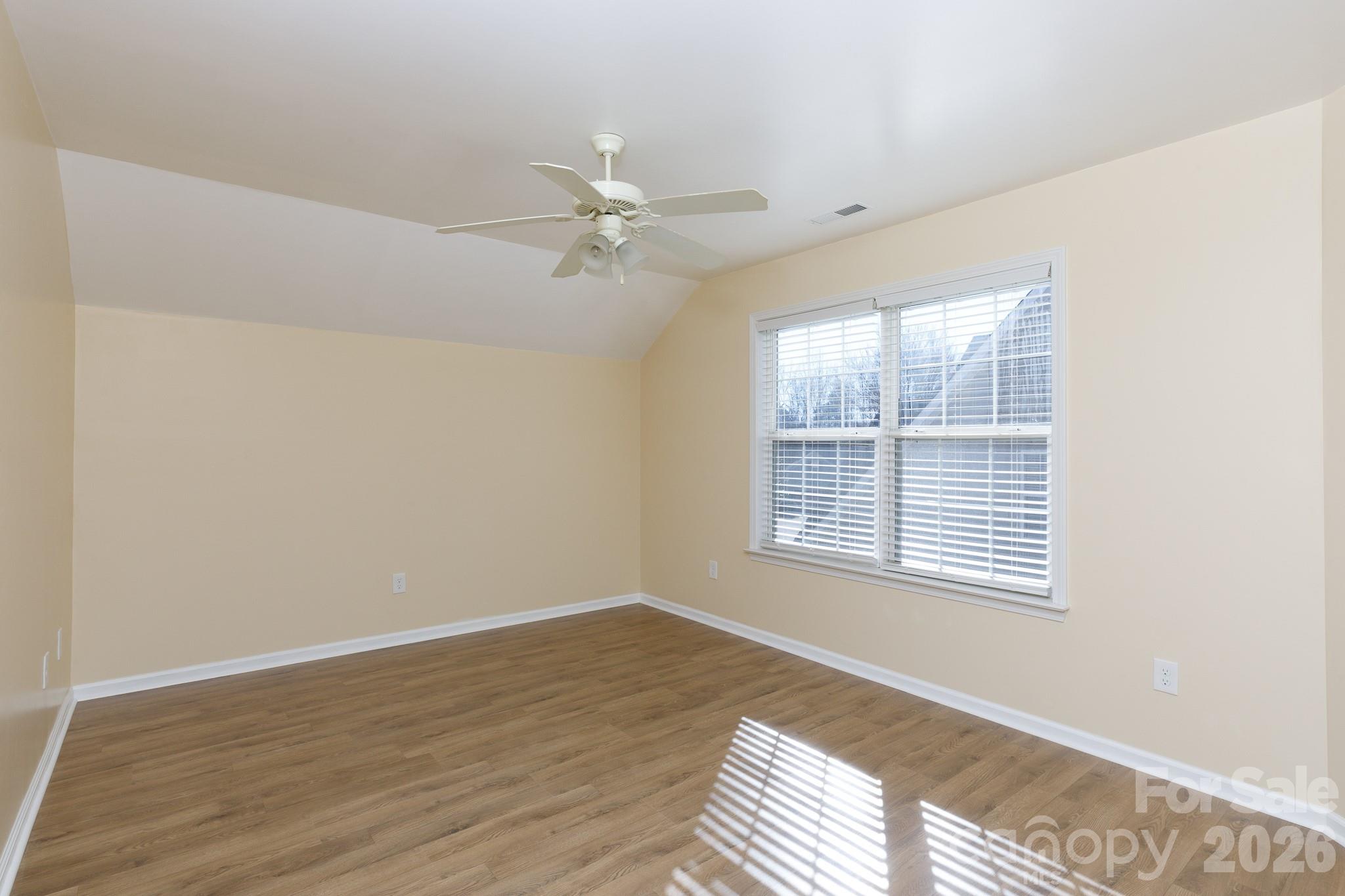 424 Elizabeth Valley Lane Clover, SC 29710 - Photo 23 of 27 a view of an empty room with wooden floor and a window