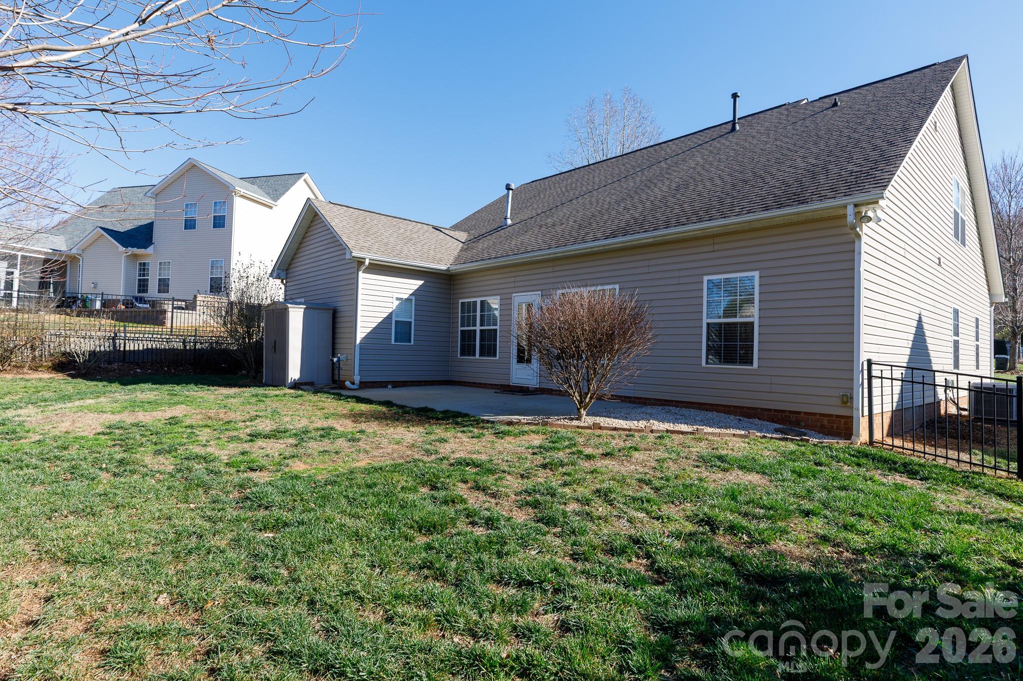 424 Elizabeth Valley Lane Clover, SC 29710 - Photo 27 of 27 a backyard of a house with table and chairs